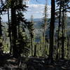 View of Bingham Lake from crest of trail, looking down at steep descent to lake.