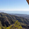 Taking a breath from the steep ascent on Cathedral Peak Trail offers stunning views of the coastal area.