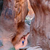 Exploring a side canyon in Fiery Furnace. Late December is a great time to visit. Fewer visitors so it is easier to get a permit for Fiery Furnace, and the low sun makes for beautiful light in the canyons.