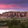 Sunset in Chesler Park. The rock formations on the south end of the meadows are a great spot for sunrises and sunsets, and also provide some shade.