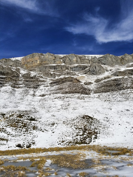 Cliffs to the left with ibex about 4/5ths of the way up (they are very small in the picture)