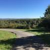 View from Baptist Church Road lot down into the park. Manny Lake in the center