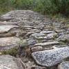 The cobblestone surface of the slaves track.