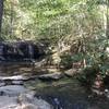 Upper section of the lower Wildcat Falls with rocks to hop across for the trail.