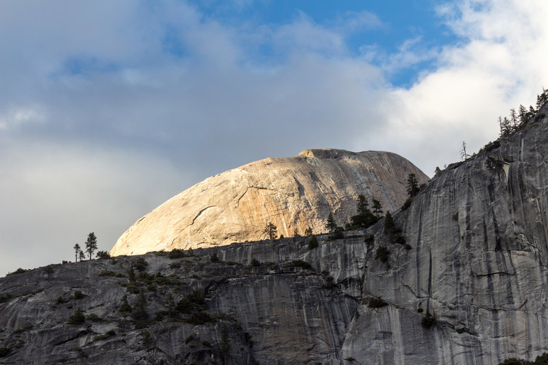 The top of Half Dome during sunset