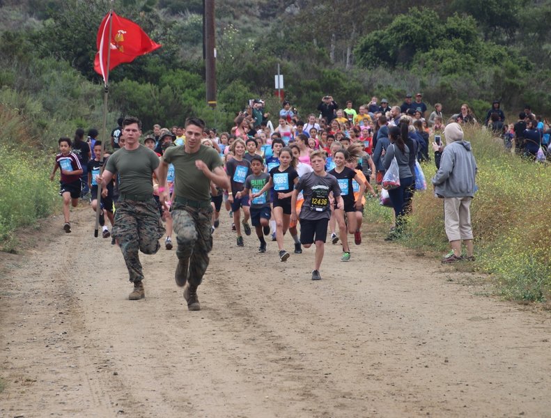 Marine Volunteers leading the kids for a run.