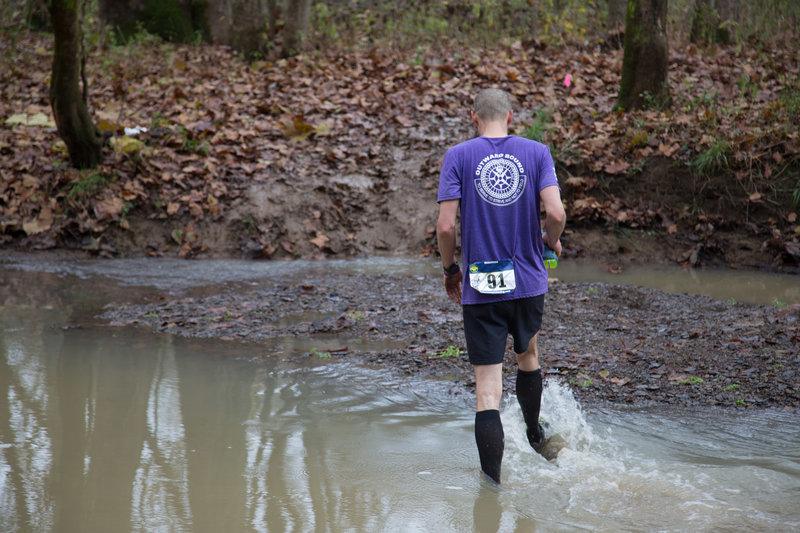 Getting the feet wet at the creek crossing in the Bobcat Trail Marathon