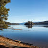 A thin layer of ice on the water in Emerald Bay with Fannette Island in the background