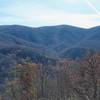 A break in the trees, thanks to high winds that blew through the area a couple of years ago, gives you good views of the surrounding mountains.