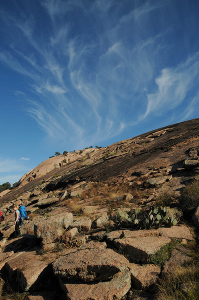 Hiking along Echo Canyon with Enchanted Rock in the background