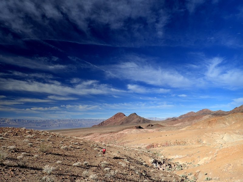 Through rolling terrain, past the pinkish mounds