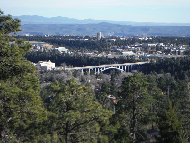 Sigma Bridge and the Los Alamos National Laboratory in the foreground and Santa Fe in the background looking southeast from the Perimeter Trail.