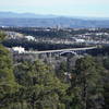 Sigma Bridge and the Los Alamos National Laboratory in the foreground and Santa Fe in the background looking southeast from the Perimeter Trail.