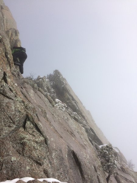 Climbing the easy 6" diagonal seam at the top of the gully.