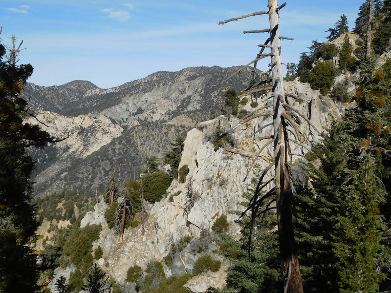 Cliffs on west side of Islip Ridge with Mt. Williamson in background.