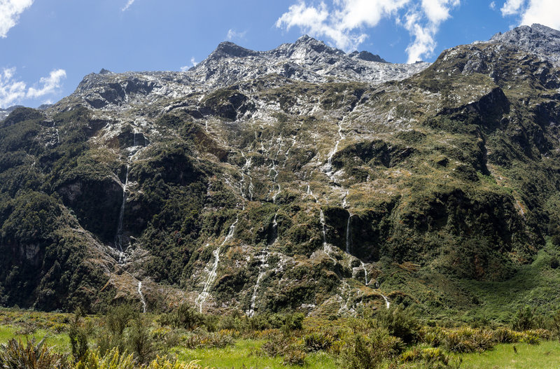 Standing in awe in front of 2,000 feet of mountain wall covered with so many small waterfalls