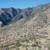 As West Montezuma Canyon Road crosses the ridge, you can see the parking lot at gap where the road crosses.   There are mountains everywhere you look!