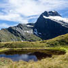 Mount Elliot with the Jervois Glacier in front of an alpine lake