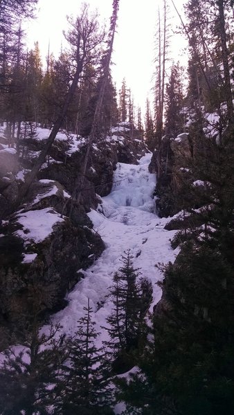 The falls are mostly frozen.