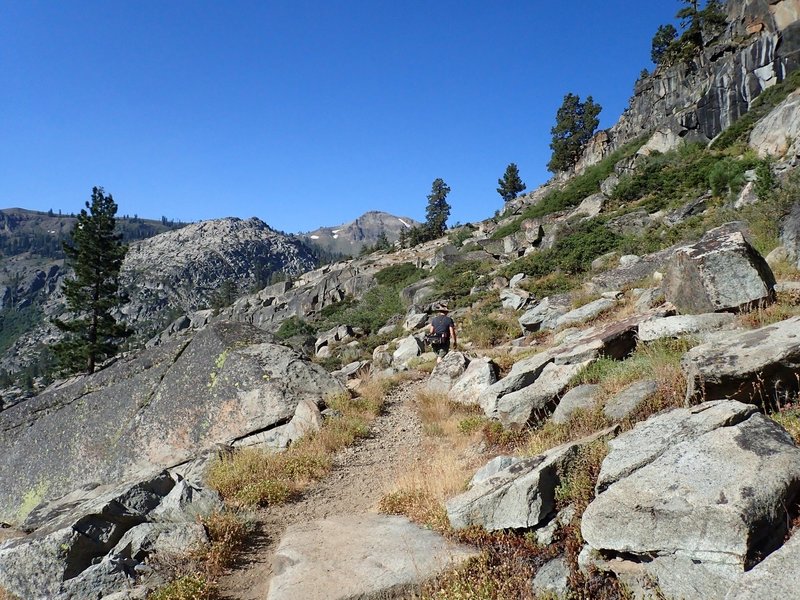 Climbing past the granite cliffs