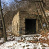 The old stone train shed on the trail towards the Ledge Quarry.