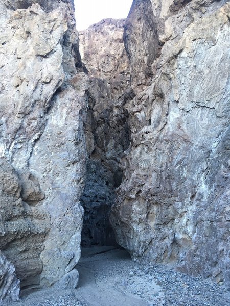 A slot canyon across the river beyond the trail end.