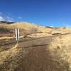 The upper loop intersects with a dirt road you must traverse for a very short distance before getting back on loop trail