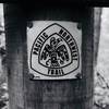 Pacific Northwest Trail marker, at the base of Goose Rock.