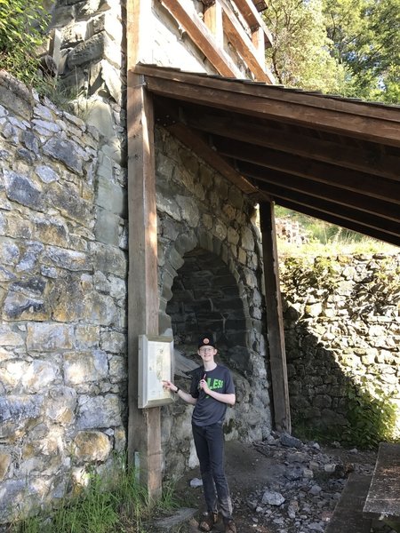 A young hiker poses next to the Kiln.