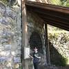 A young hiker poses next to the Kiln.