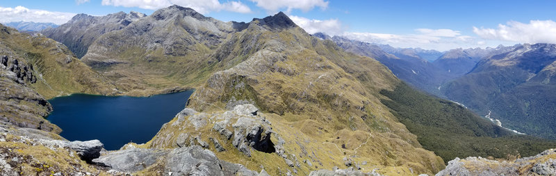 Panorama across Lake Harris, Harris Saddle, and the Hollyford Valley