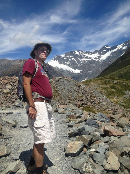 Hiker at the end of the Hooker Valley Track