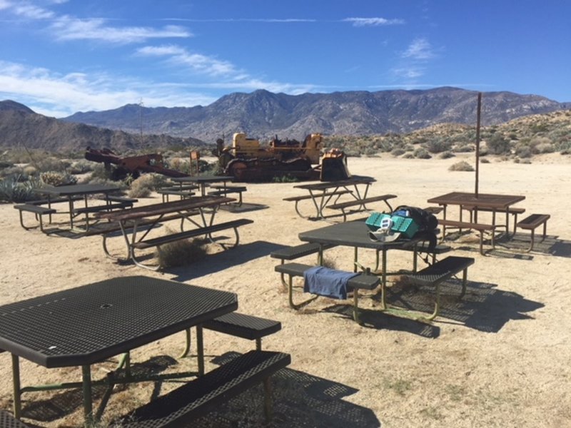 The western terminus of the Art Smith Trail at Dunn Road has picnic tables and is a great rest spot.  Some cell phone service.