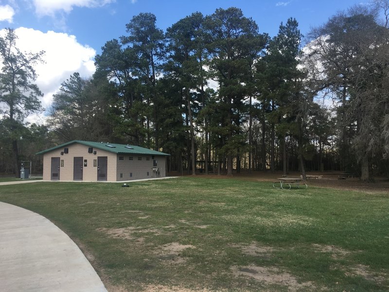 Public restrooms, tables, and sand volleyball, and piers over the lake are all available at the start of the trail near the larger parking lot.