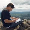 Signing the summit journal of Mt. Baldy.