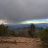 A storm sweeps past the summit of Yamsay Mountain