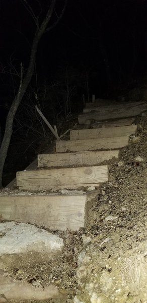 Top of ridge. Wooden stairs. Was lovely at night. Could hear water dripping off the rocks.