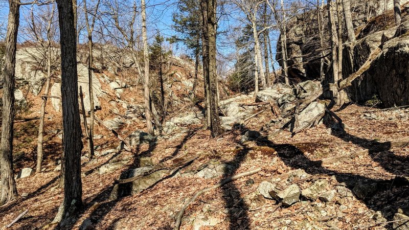 Dark shadows play among interesting rock formations on the Long Path is Harriman State Park