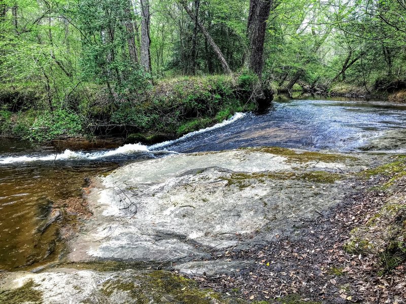 The creek running over smooth rock