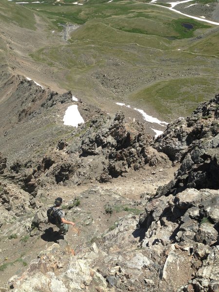 A steep, loose, and exposed descent with some minor down climbing.