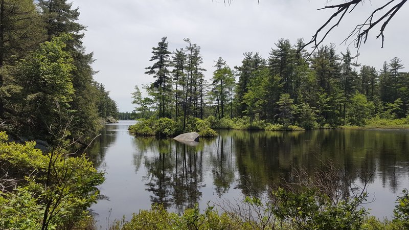 First lake you encounter on the trail. Take a little side trail for a good view.