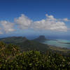 Excellent views south from the summit. The prominent rock surrounded by reefs is Le Morne Brabant, and UNESCO site with a tragic history.