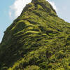 The summit trail is clearly visible along the final part of the "thumb". Note the hiker in white in the middle of the picture.