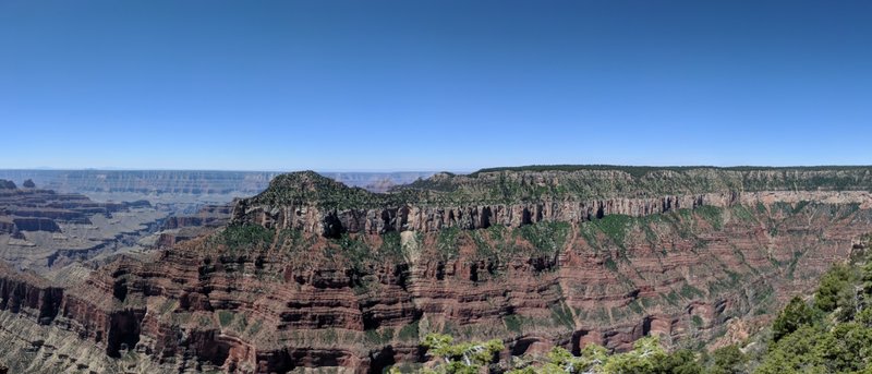 A short ways from the south of Bright Angel and Transept Trail. Just left of center is Oza Butte. Transept Gorge below. What looks like a ridge is a square peninsula that includes the Widforss hike.