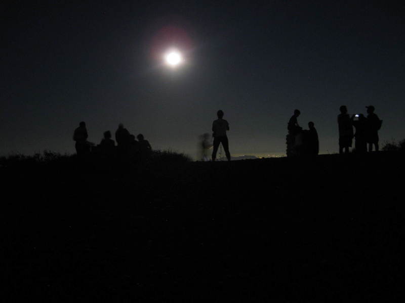 On the top, under a full moon