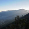 Sun beams shine onto Cilaos far below Grand Benare.