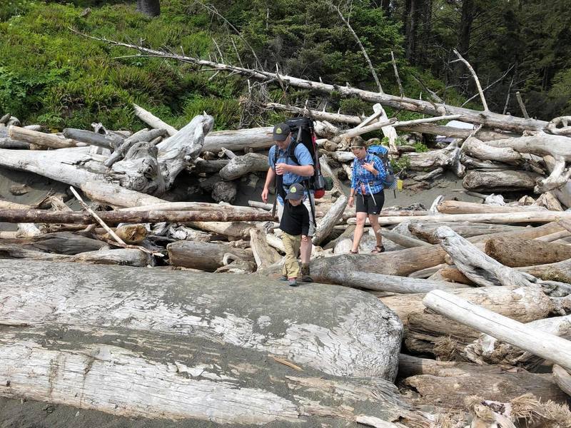 Crossing the driftwood pile to get to the beach