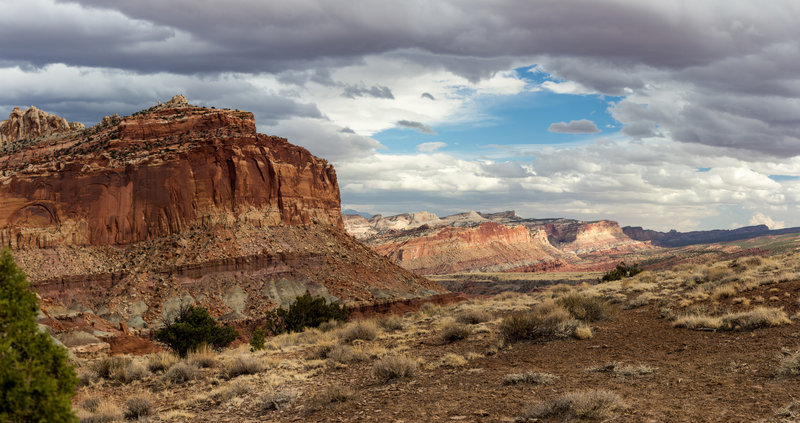 The last sun illuminating the Waterpocket Fold on a cloudy evening