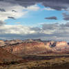 Blue sky above the Waterpocket Fold on an otherwise cloudy evening