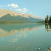 Brazeau Lake, a large backcountry lake, in the early morning, looking west-northwest along the shore at the Brazeau Lake Trail Camp.